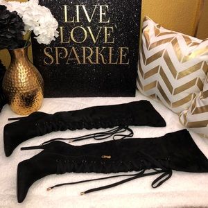 *Black thigh high boots with laces*